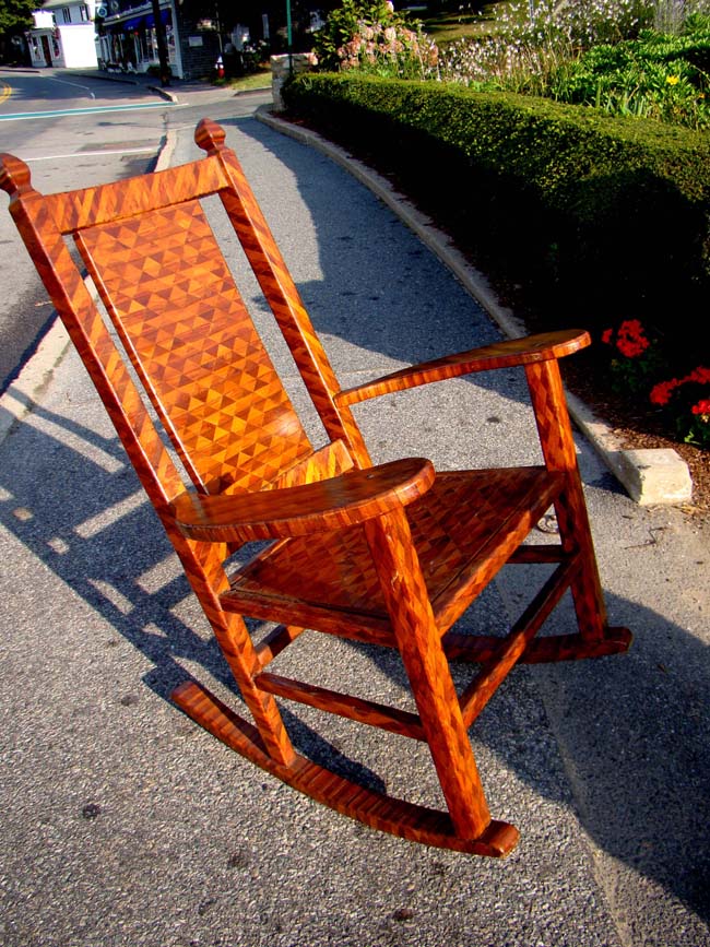 A fabulous American folk art parquetry inlaid rocking arm chair circa 1900-1920